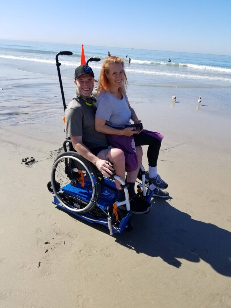 Smiling duo on sandy beach