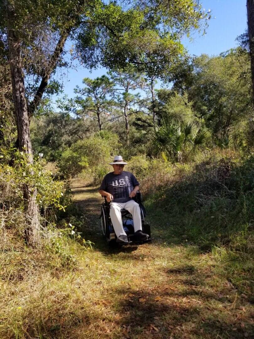 Outdoor trail with wheelchair user